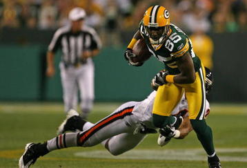 GREEN BAY, WI - SEPTEMBER 13: Greg Jennings #85 of the Green Bay Packers breaks away from Al Afalava #24 of the Chicago Bears on September 13, 2009 at Lambeau Field in Green Bay, Wisconsin. (Photo by Jonathan Daniel/Getty Images)