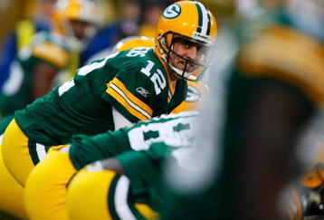 GREEN BAY, WI - NOVEMBER 01:  Quarterback Aaron Rodgers #12 of the Green Bay Packers calls out a play against the Minnesota Vikings during the second quarter of the game at Lambeau Field on November 1, 2009 in Green Bay, Wisconsin. (Photo by Scott Boehm/Getty Images)
