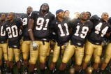 SOUTH BEND, IN - SEPTEMBER 13: Golden Tate #23, Pat Kuntz #96, Asaph Schwapp #44, George West #19, David Grimes #11, Emeka Nwankwo #91 and Terrail Lambert #20 of the Notre Dame Fighting Irish celebrate after a 35-17 victory over the Michigan Wolverines on September 13, 2008 at Notre Dame Stadium in South Bend, Indiana.  (Photo by Gregory Shamus/Getty Images)