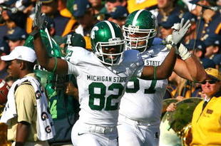 SOUTH BEND, IN - SEPTEMBER 19: Keshawn Martin #82 of the Michigan State Spartans celebrates throwing a touchdown pass on an option play against the Notre Dame Fighting Irish on September 19, 2009 at Notre Dame Stadium in South Bend, Indiana. (Photo by Jonathan Daniel/Getty Images)