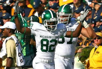 SOUTH BEND, IN - SEPTEMBER 19: Keshawn Martin #82 of the Michigan State Spartans celebrates throwing a touchdown pass on an option play against the Notre Dame Fighting Irish on September 19, 2009 at Notre Dame Stadium in South Bend, Indiana. (Photo by Jonathan Daniel/Getty Images)