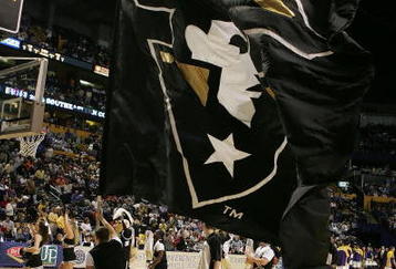 NASHVILLE, TN - MARCH 10:  A cheerleader from the Vanderbilt Commodores runs with a flag prior to Vanderbilt's game against the LSU Tigers during day 2 of the SEC Men's Basketball Conference Tournament March 10, 2006 at the Gaylord Entertainment Center in Nashville, Tennessee.  LSU won 92-73. (Photo by Andy Lyons/Getty Images)