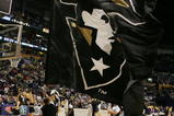 NASHVILLE, TN - MARCH 10:  A cheerleader from the Vanderbilt Commodores runs with a flag prior to Vanderbilt's game against the LSU Tigers during day 2 of the SEC Men's Basketball Conference Tournament March 10, 2006 at the Gaylord Entertainment Center in Nashville, Tennessee.  LSU won 92-73. (Photo by Andy Lyons/Getty Images)