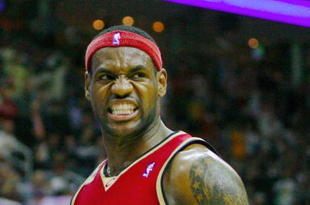 CLEVELAND - OCTOBER 27:  LeBron James #23 of the Cleveland Cavaliers reacts during the season opener against the Boston Celtics at Quicken Loans Arena on October 27, 2009 in Cleveland, Ohio.  NOTE TO USER: User expressly acknowledges and agrees that, by downloading and or using this photograph, User is consenting to the terms and conditions of the Getty Images License Agreement. (Photo by Gregory Shamus/Getty Images)