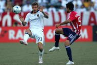 CARSON, CA - NOVEMBER 01:  David Beckham #23 of the Los Angeles Galaxy pressures the play of Marcelo Saragosa #55 of Chivas USA in the first half during Game 1 of the MLS Western Conference Semifinals match at The Home Depot Center on November 1, 2009 in Carson, California.  The Galaxy and Chivas USA played to a 2-2 draw. (Photo by Victor Decolongon/Getty Images)