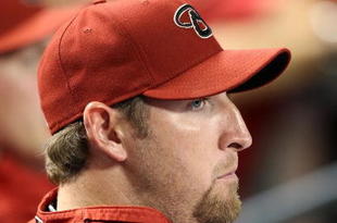PHOENIX - APRIL 10:  Pitcher Brandon Webb #17 of the Arizona Diamondbacks looks on during the game  against the Los Angeles Dodgers at Chase Field on April 10, 2009 in Phoenix, Arizona. The Diamondbacks defeated the Dodgers 9-4.  (Photo by Christian Petersen/Getty Images)