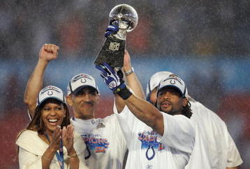 MIAMI GARDENS, FL - FEBRUARY 04:  Bob Sanders #21 of  the Indianapolis Colts celebrates with the Vince Lombardi Trophy, next to head coach Tony Dungy and his wife Lauren Dungy, after the Colts 29-17 win against the Chicago Bears in Super Bowl XLI on February 4, 2007 at Dolphin Stadium in Miami Gardens, Florida.  (Photo by Jonathan Daniel/Getty Images)