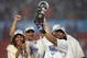MIAMI GARDENS, FL - FEBRUARY 04: Bob Sanders #21 of the Indianapolis Colts celebrates with the Vince Lombardi Trophy, next to head coach Tony Dungy and his wife Lauren Dungy, after the Colts 29-17 win against the Chicago Bears in Super Bowl XLI on February 4, 2007 at Dolphin Stadium in Miami Gardens, Florida. (Photo by Jonathan Daniel/Getty Images)