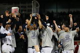 NEW YORK - NOVEMBER 04:  Mariano Rivera #42 of the New York Yankees holds up the trophy as he celebrates with his teammates after their 7-3 win against the Philadelphia Phillies in Game Six of the 2009 MLB World Series at Yankee Stadium on November 4, 2009 in the Bronx borough of New York City.  (Photo by Chris McGrath/Getty Images)