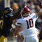 BERKELEY, CA - OCTOBER 24:  Jeff Tuel #10 of the Washington State Cougars passes against Cameron Jordan #97 of the California Golden Bears at California Memorial Stadium on October 24, 2009 in Berkeley, California.  (Photo by Jed Jacobsohn/Getty Images)