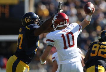 BERKELEY, CA - OCTOBER 24:  Jeff Tuel #10 of the Washington State Cougars passes against Cameron Jordan #97 of the California Golden Bears at California Memorial Stadium on October 24, 2009 in Berkeley, California.  (Photo by Jed Jacobsohn/Getty Images)