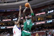 PHILADELPHIA - NOVEMBER 03: Kevin Garnett #5 of the Boston Celtics attempts a shot against Samuel Dalembert #1 and Andre Iguodala #9 of the Philadelphia 76ers at the Wachovia Center on November 3, 2009 in Philadelphia, Pennsylvania. NOTE TO USER: User expressly acknowledges and agrees that, by downloading and or using this photograph, User is consenting to the terms and conditions of the Getty Images License Agreement. (Photo by Chris Chambers/Getty Images)
