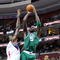 PHILADELPHIA - NOVEMBER 03: Kevin Garnett #5 of the Boston Celtics attempts a shot against Samuel Dalembert #1 and Andre Iguodala #9 of the Philadelphia 76ers at the Wachovia Center on November 3, 2009 in Philadelphia, Pennsylvania. NOTE TO USER: User expressly acknowledges and agrees that, by downloading and or using this photograph, User is consenting to the terms and conditions of the Getty Images License Agreement. (Photo by Chris Chambers/Getty Images)