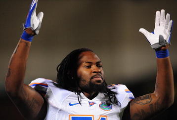 STARKVILLE, MS - OCTOBER 24:  Linebacker Brandon Spikes # 51 of the Florida Gators signals a touchdown against the Mississippi Bulldogs, at Davis Wade Stadium on  October 24, 2009 in Starkville, Mississippi  (Photo by Rick Dole/Getty Images)