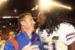 MIAMI - JANUARY 08:  Head coach Urban Meyer of the Florida Gators celebrates with Brandon Spikes #51 their win over the Oklahoma Sooners after the FedEx BCS National Championship Game at Dolphin Stadium on January 8, 2009 in Miami, Florida.  (Photo by Donald Miralle/Getty Images)