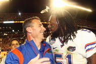 MIAMI - JANUARY 08: Head coach Urban Meyer of the Florida Gators celebrates with Brandon Spikes #51 their win over the Oklahoma Sooners after the FedEx BCS National Championship Game at Dolphin Stadium on January 8, 2009 in Miami, Florida. (Photo by Donald Miralle/Getty Images)