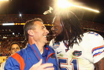 MIAMI - JANUARY 08:  Head coach Urban Meyer of the Florida Gators celebrates with Brandon Spikes #51 their win over the Oklahoma Sooners after the FedEx BCS National Championship Game at Dolphin Stadium on January 8, 2009 in Miami, Florida.  (Photo by Donald Miralle/Getty Images)