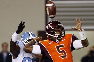 BLACKSBURG, VA - OCTOBER 29:  Quarterback Tyrod Taylor #5 of the Virginia Tech University Hokies is defended by E.J. Wilson #92 of the North Carolina Tar Heels during the  game at Lane Stadium on October 29, 2009 in Blacksburg, Virginia.  (Photo by Scott Halleran/Getty Images)