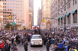 NEW YORK - NOVEMBER 06:  Derek Jeter # 2 and Jorge Posada # 20 of the New York Yankees celebrate on a float during the Yankees World Series Victory Parade on November 6, 2009 in New York City.  (Photo by Michael Loccisano/Getty Images)
