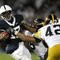 STATE COLLEGE, PA - SEPTEMBER 26:  Daryll Clark #17 of the Penn State Nittnay Lions is tackled by Karl Klug #95 and Jeremiha Hunter #42 of the Iowa Hawkeye's on September 26, 2009 at Beaver Stadium in State College, Pennsylvania.  (Photo by Gregory Shamus/Getty Images)