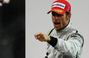 ABU DHABI, UNITED ARAB EMIRATES - NOVEMBER 01: Jenson Button of Great Britain and Brawn GP celebrates on the podium after finishing third during the Abu Dhabi Formula One Grand Prix at the Yas Marina Circuit on November 1, 2009 in Abu Dhabi, United Arab Emirates. (Photo by Mark Thompson/Getty Images)
