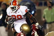 TALLAHASSEE, FL - SEPTEMBER 16: Linebacker Marcus Ball #44 of the Florida State Seminoles brings down running back C.J. Spiller #28 of the Clemson Tigers at Doak Campbell Stadium on September 16, 2006 in Tallahassee, Florida. (Photo by Doug Benc/Getty Images)