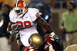 TALLAHASSEE, FL - SEPTEMBER 16:  Linebacker Marcus Ball #44 of the Florida State Seminoles brings down running back C.J. Spiller #28 of the Clemson Tigers at Doak Campbell Stadium on September 16, 2006 in Tallahassee, Florida.  (Photo by Doug Benc/Getty Images)