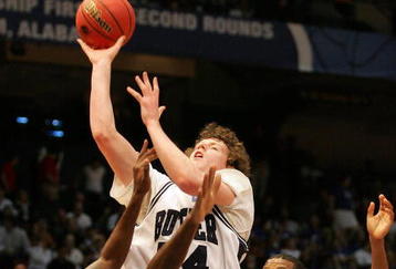 BIRMINGHAM, AL - MARCH 21:  Matt Howard #54 of the Butler Bulldogs shoots over Brandon Davis #21 and DeAndre Coleman #1 of the South Alabama Jaguars during the first round of the South Regional as part of the 2008 NCAA Men's Basketball Tournament at the Birmingham-Jefferson Civic Center on March 21, 2008 in Birmingham, Alabama.  (Photo by Dave Martin/Getty Images)