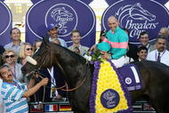 ARCADIA, CA - OCTOBER 24:  Jockey Mike Smith atop Zenyatta pose with owners and trainers in the winner's circle after winning the Breeders' Cup Ladies Classic during the Breeders' Cup World Championships at Santa Anita Park October 24, 2008 in Arcadia, California.  (Photo by Christian Petersen/Getty Images)