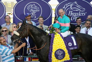 ARCADIA, CA - OCTOBER 24:  Jockey Mike Smith atop Zenyatta pose with owners and trainers in the winner's circle after winning the Breeders' Cup Ladies Classic during the Breeders' Cup World Championships at Santa Anita Park October 24, 2008 in Arcadia, California.  (Photo by Christian Petersen/Getty Images)
