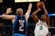 NEW ORLEANS - APRIL 19: Chris Paul #3 of the New Orleans Hornets makes a shot over Jason Kidd #2 of the Dallas Mavericks in Game One of the Western Conference Quarterfinals during the 2008 NBA Playoffs at The New Orleans Arena on April 19, 2008 in New Orleans, Louisiana. NOTE TO USER: User expressly acknowledges and agrees that, by downloading and or using this photograph, User is consenting to the terms and conditions of the Getty Images License Agreement. (Photo by Chris Graythen/Getty Images)