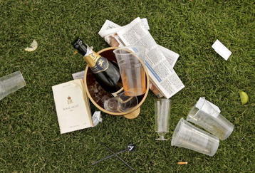 ASCOT, UNITED KINGDOM - JUNE 20:  A empty champagne bottle lies in a bucket on the ground after the first day of Royal Ascot, at the Ascot Racecourse on June 20, 2006 in Ascot, England.  The event has been one of the highlights of the racing and social calendar since 1711, and the royal patronage continues today with a Royal Procession taking place in front of the grandstands daily.  (Photo by Scott Barbour/Getty Images)