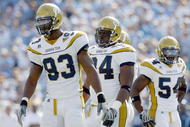 CHAPEL HILL, NC - NOVEMBER 08: Elris Anyaibe #94 of the Georgia Tech Yellow Jackets stands on the field with Michael Johnson #93 and Sedric Griffin #54 during the game against the North Carolina Tar Heels at Kenan Stadium on November 8, 2008 in Chapel Hill, North Carolina. (Photo by Kevin C. Cox/Getty Images)