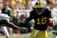 ANN ARBOR, MI - SEPTEMBER 19: Quarterback Denard Robinson #16 of the Michigan Wolverines carries the ball on a 13 yard touchdown run in the fourth quarter against the Eastern Michigan Eagles at Michigan Stadium on September 19, 2009 in Ann Arbor, Michigan. (Photo by Stephen Dunn/Getty Images)