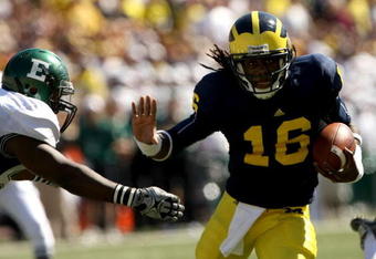 ANN ARBOR, MI - SEPTEMBER 19:  Quarterback Denard Robinson #16 of the Michigan Wolverines carries the ball on a 13 yard touchdown run in the fourth quarter against the Eastern Michigan Eagles at Michigan Stadium on September 19, 2009 in Ann Arbor, Michigan.  (Photo by Stephen Dunn/Getty Images)