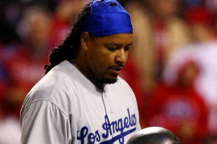 PHILADELPHIA - OCTOBER 19:  Manny Ramirez #99 of the Los Angeles Dodgers reacts after he struck out in the top of the eighth inning against of the Philadelphia Phillies in Game Four of the NLCS during the 2009 MLB Playoffs at Citizens Bank Park on October 19, 2009 in Philadelphia, Pennsylvania.  (Photo by Chris McGrath/Getty Images)