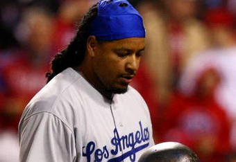 PHILADELPHIA - OCTOBER 19:  Manny Ramirez #99 of the Los Angeles Dodgers reacts after he struck out in the top of the eighth inning against of the Philadelphia Phillies in Game Four of the NLCS during the 2009 MLB Playoffs at Citizens Bank Park on October 19, 2009 in Philadelphia, Pennsylvania.  (Photo by Chris McGrath/Getty Images)