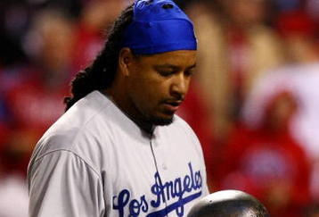 PHILADELPHIA - OCTOBER 19:  Manny Ramirez #99 of the Los Angeles Dodgers reacts after he struck out in the top of the eighth inning against of the Philadelphia Phillies in Game Four of the NLCS during the 2009 MLB Playoffs at Citizens Bank Park on October 19, 2009 in Philadelphia, Pennsylvania.  (Photo by Chris McGrath/Getty Images)