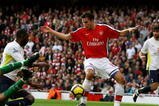 LONDON, ENGLAND - OCTOBER 31:  Robin Van Persie of Arsenal scores the third goal during the Barclays Premier League match between Arsenal and Tottenham Hotspur at the Emirates Stadium on October 31, 2009 in London, England.  (Photo by Shaun Botterill/Getty Images)