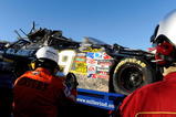 TALLADEGA, AL - NOVEMBER 01:  Safety workers look over the #39 U.S Army Chevrolet, driven by Ryan Newman, during the NASCAR Sprint Cup Series AMP Energy 500 at Talladega Superspeedway on November 1, 2009 in Talladega, Alabama.  (Photo by Rusty Jarrett/Getty Images for NASCAR)