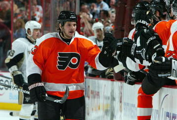 PHILADELPHIA - APRIL 21:  Daniel Carcillo #13 of the Philadelphia Flyers celebrates his goal against the Pittsburgh Penguins during Game Four of the Eastern Conference Quarterfinal Round of the 2009 NHL Stanley Cup Playoffs  at the Wachovia Center on April 21, 2009 in Philadelphia, Pennsylvania. The Penguins defeated the Flyers 3-1 to take a three games to one lead in the series.  (Photo by Jim McIsaac/Getty Images)
