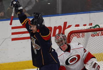 SUNRISE, FL - NOVEMBER 4: Steven Reinprecht #27 of the Florida Panthers celebrates after scoring a goal against Cam Ward #30 of the Carolina Hurricanes in the3 third period on November 4, 2009 at the BankAtlantic Center in Sunrise, Florida. The Panthers defeated the Hurricanes 3-0. (Photo by Joel Auerbach/Getty Images)
