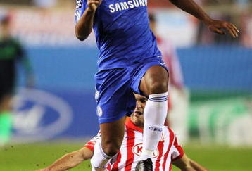 MADRID, SPAIN - NOVEMBER 03:  Didier Drogba   of Chelsea skips the tackle from Pablo Ibanez of Atletico Madrid during Champions League Group D match between Atletico Madrid and Chelsea at the Vicente Calderon Stadium on November 3, 2009 in Madrid, Spain.  (Photo by Shaun Botterill/Getty Images)