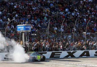 FORT WORTH, TX - APRIL 05:  Jeff Gordon, driver of the #24 DuPont Chevrolet, does a victory burnout after winning the NASCAR Sprint Cup Series Samsung 500 at Texas Motor Speedway on April 5, 2009 in Fort Worth, Texas.  (Photo by Tom Pennington/Getty Images for NASCAR)