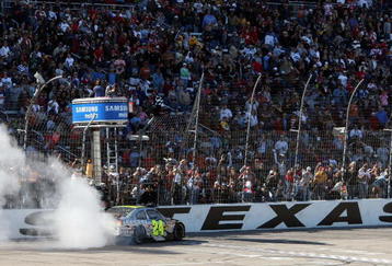 FORT WORTH, TX - APRIL 05:  Jeff Gordon, driver of the #24 DuPont Chevrolet, does a victory burnout after winning the NASCAR Sprint Cup Series Samsung 500 at Texas Motor Speedway on April 5, 2009 in Fort Worth, Texas.  (Photo by Tom Pennington/Getty Images for NASCAR)