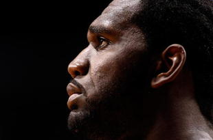 PORTLAND, OR - OCTOBER 27:  Greg Oden #52 of the Portland Trail Blazers watches a free throw attempt by the Houston Rockets during the season opener on October 27, 2009 at the Rose Garden in Portland, Oregon. NOTE TO USER: User expressly acknowledges and agrees that, by downloading and or using this Photograph, user is consenting to the terms and conditions of the Getty Images License Agreement.  (Photo by Jonathan Ferrey/Getty Images)