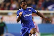 MADRID, SPAIN - NOVEMBER 03:  Didier Drogba   of Chelsea skips the tackle from Pablo Ibanez of Atletico Madrid during Champions League Group D match between Atletico Madrid and Chelsea at the Vicente Calderon Stadium on November 3, 2009 in Madrid, Spain.  (Photo by Shaun Botterill/Getty Images)