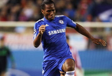 MADRID, SPAIN - NOVEMBER 03:  Didier Drogba   of Chelsea skips the tackle from Pablo Ibanez of Atletico Madrid during Champions League Group D match between Atletico Madrid and Chelsea at the Vicente Calderon Stadium on November 3, 2009 in Madrid, Spain.  (Photo by Shaun Botterill/Getty Images)