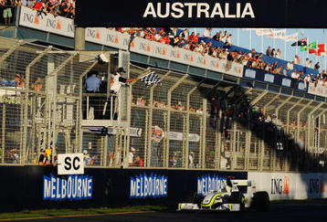 MELBOURNE, AUSTRALIA - MARCH 29:  Jenson Button of Great Britain and Brawn GP takes the chequered flag as he crosses the finish line to win the Australian Formula One Grand Prix at the Albert Park Circuit on March 29, 2009 in Melbourne, Australia.  (Photo by Robert Cianflone/Getty Images)