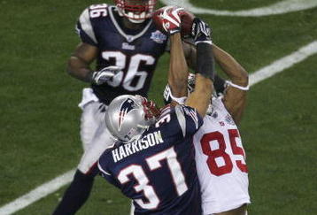 GLENDALE, AZ - FEBRUARY 03:  David Tyree #85 of the New York Giants catches a 32-yard pass from Eli Manning #10 as Rodney Harrison #37 of the New England Patriots attempts to knock it out in the fourth quarter of Super Bowl XLII on February 3, 2008 at the University of Phoenix Stadium in Glendale, Arizona.  (Photo by Jim McIsaac/Getty Images)